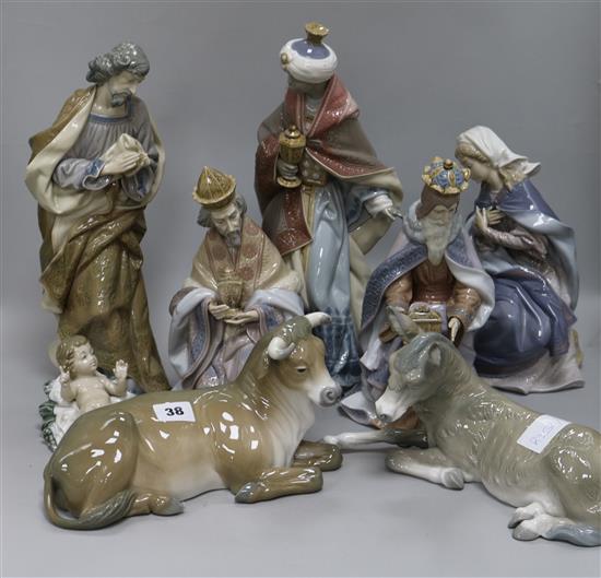A Lladro nativity scene: Jesus, Joseph, Mary, Three Wise Kings and a donkey and a cow